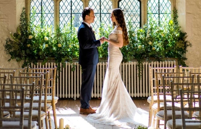 Bride and groom at end of aisle