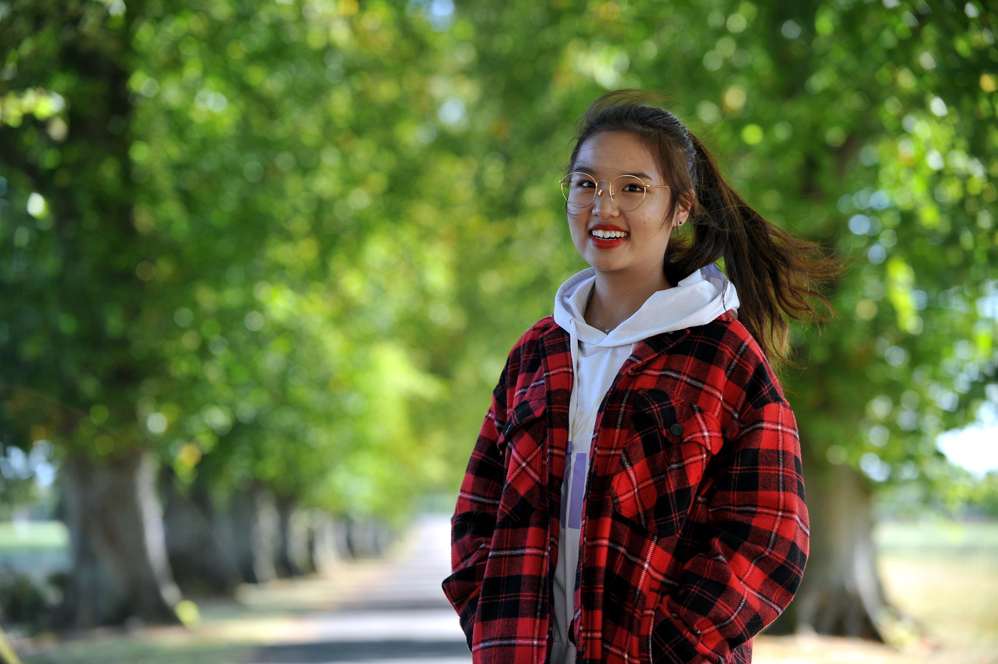 Student standing on main driveway