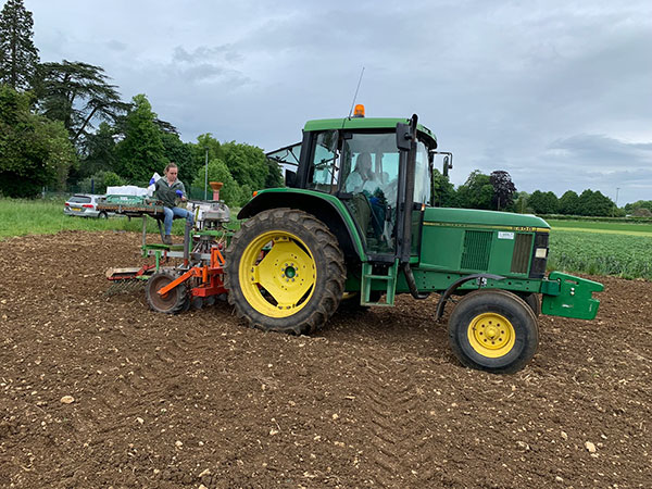 students learning to drill a field