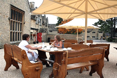 people eating at table outside the rau