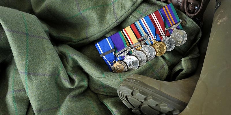 Image showing tweeds, boots and a row of military medals