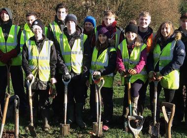 Group photo of students planting trees for Tree Week 2018